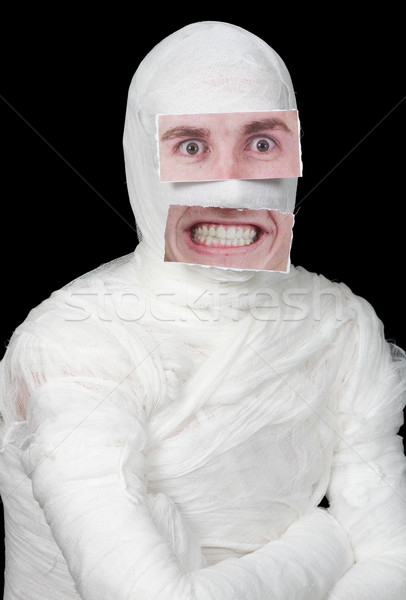 Bandaged man with false paper face Stock photo © pzaxe