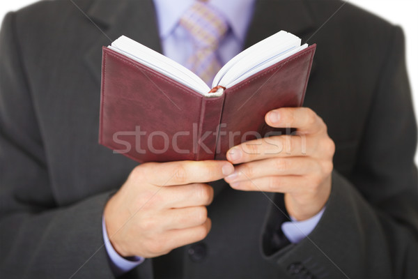Man reads entries in notebook - close-up Stock photo © pzaxe