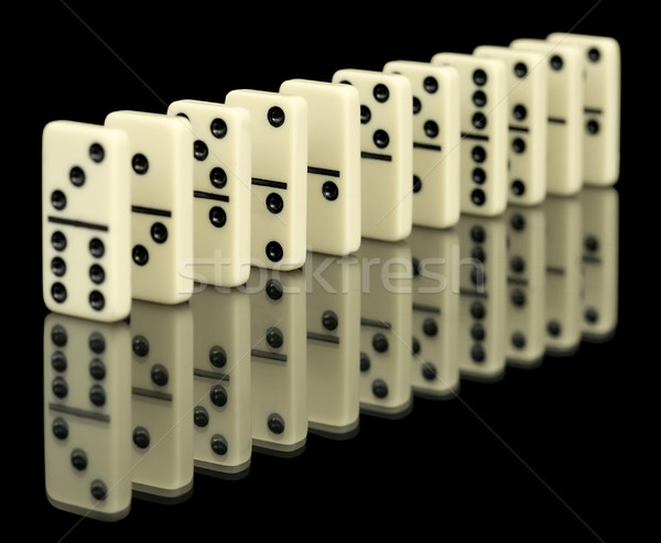 Bones of domino on black Stock photo © pzaxe