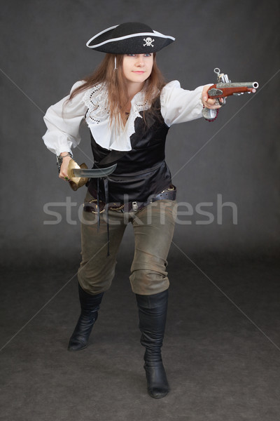 Woman in a costume of sea pirate attack Stock photo © pzaxe