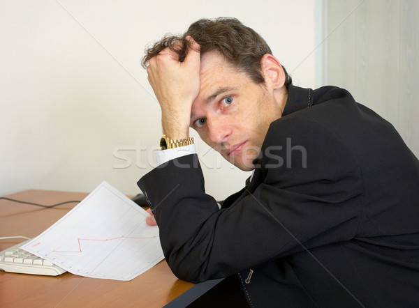 Sorrowful man at the office, on a workplace Stock photo © pzaxe