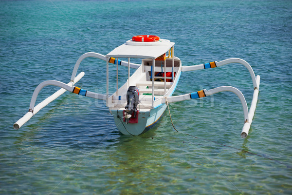 Balinese traditional boat with motor - double outrigger jukung Stock photo © pzaxe