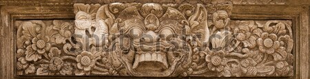 Oribil mitic monstru faţă piatră relief Imagine de stoc © pzaxe