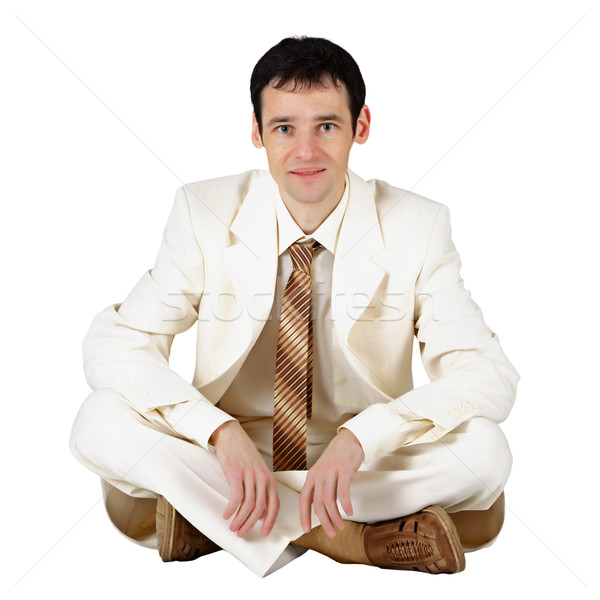 Stock photo: Business man sitting on a white