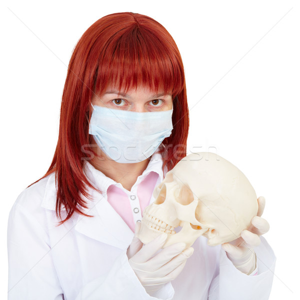 Woman - nurse with skull in hands Stock photo © pzaxe