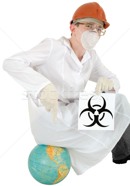 Scientist with poster biohazard sit on a globe Stock photo © pzaxe