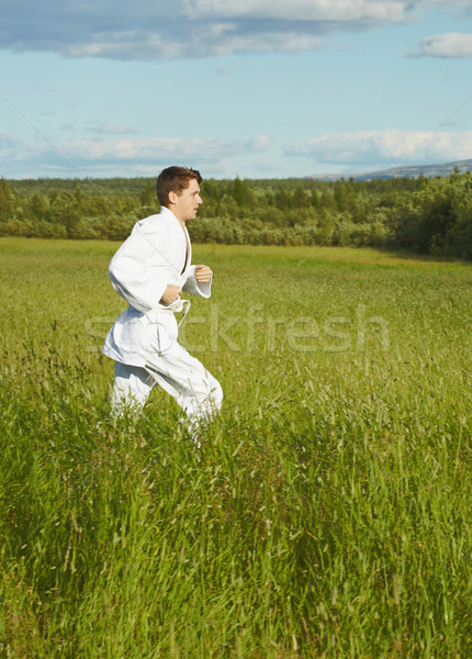 Young man is engaged in run Stock photo © pzaxe