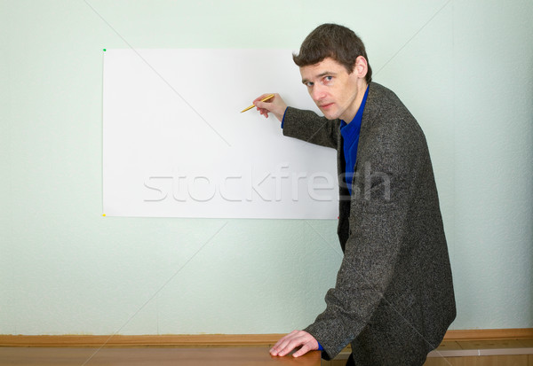 Stock photo: Teacher showing on the poster