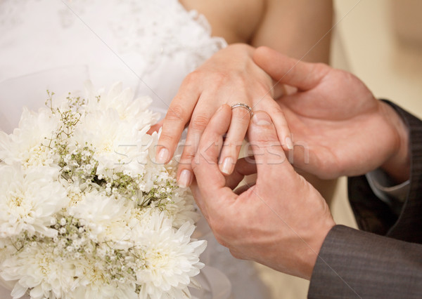 Hands of groom and bride with ring close up Stock photo © pzaxe