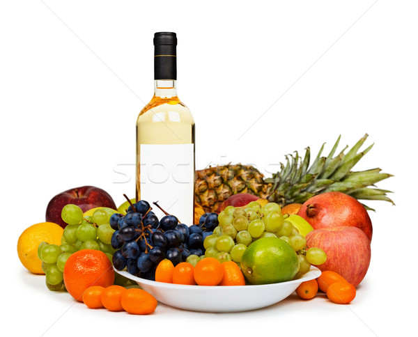 Still life - bottle of white wine among fruits on white Stock photo © pzaxe