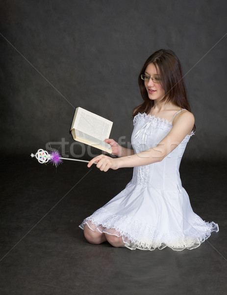 Girl - fairy with magic wand and book in hands Stock photo © pzaxe