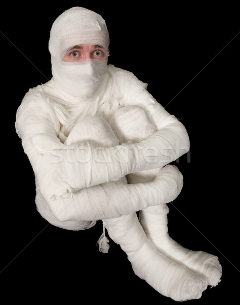 Egyptian mummy emo sitting on a black Stock photo © pzaxe