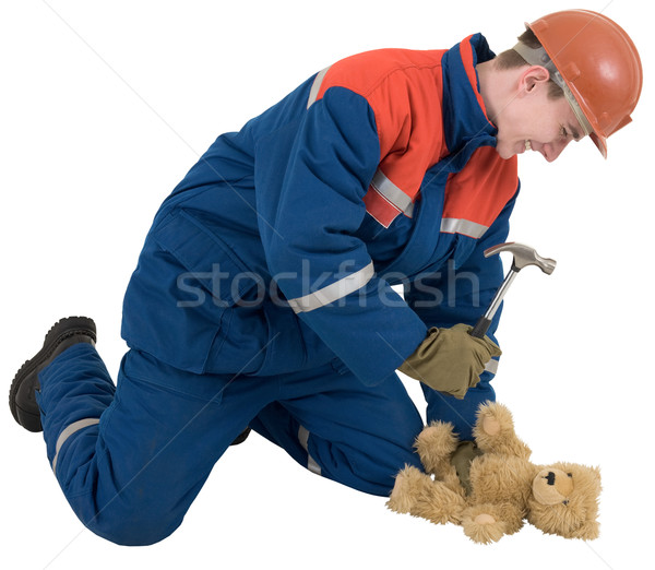 Man with hammer and toy bear Stock photo © pzaxe
