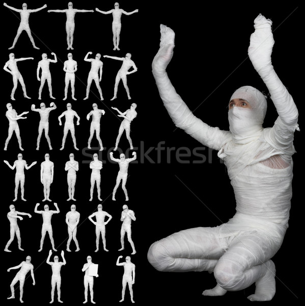 Collection of bandaged mummies isolated on black background Stock photo © pzaxe