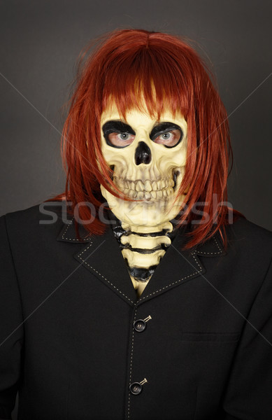 Funny man in mask a skull and wig Stock photo © pzaxe