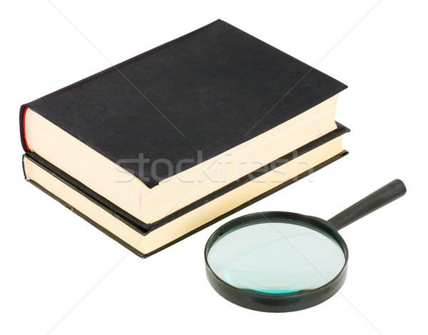 Stock photo: Books and magnifying glass