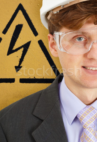 Safety engineer on background of warning signs Stock photo © pzaxe