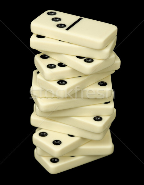 Tower from dominoes bones on a black Stock photo © pzaxe