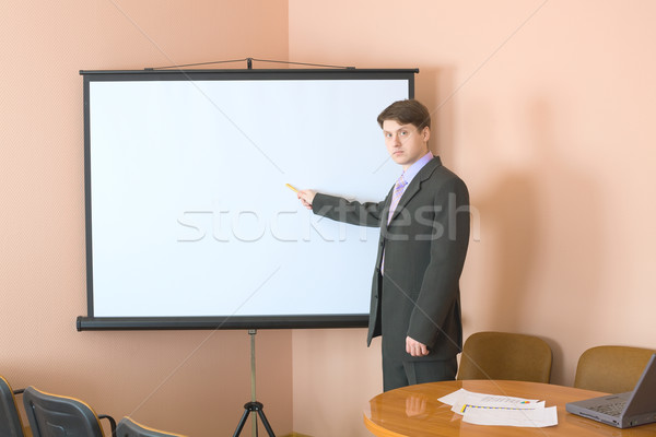 Businessman near the white screen Stock photo © pzaxe