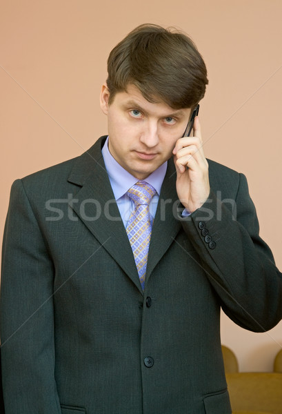 Man speaks by a mobile phone Stock photo © pzaxe