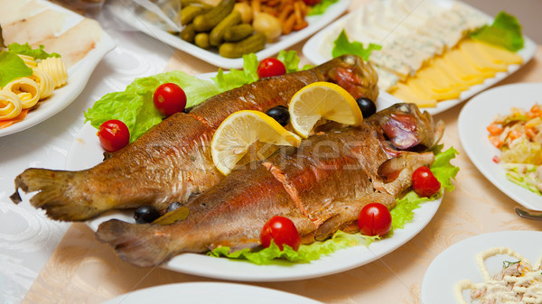 Delicious fried fish on table Stock photo © pzaxe