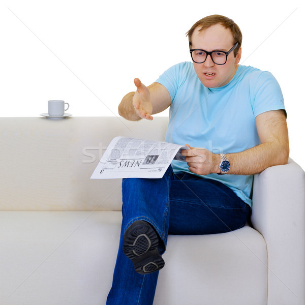 Funny man dissatisfied with news from the newspaper Stock photo © pzaxe