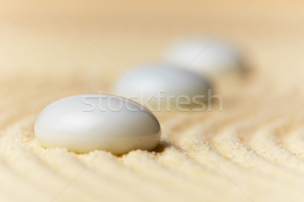Glass drops on sand surface Stock photo © pzaxe