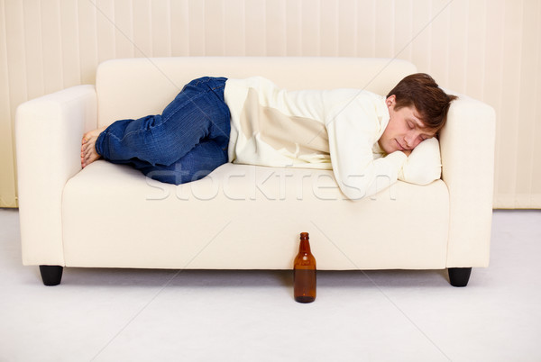 People comfortable sleeps on sofa having got drunk beer Stock photo © pzaxe