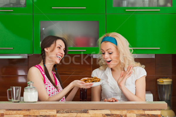 Young girl treats his girlfriend Stock photo © pzaxe