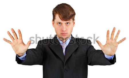 Young businessman extended his arms to show us - stop! Stock photo © pzaxe