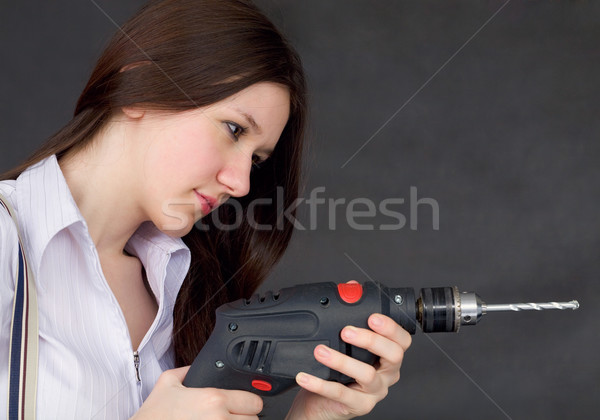 Female student learns to use a drill Stock photo © pzaxe