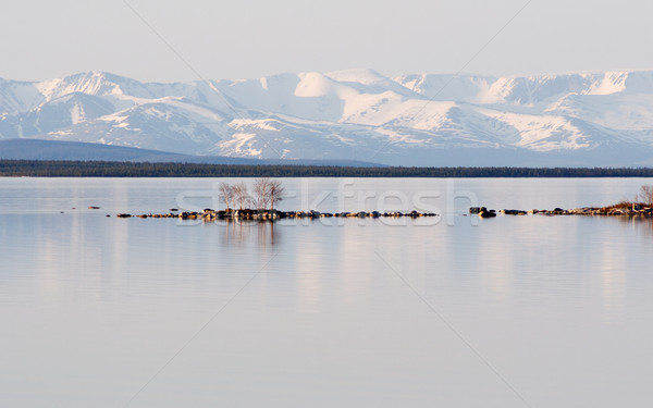 Stony island among lake Stock photo © pzaxe