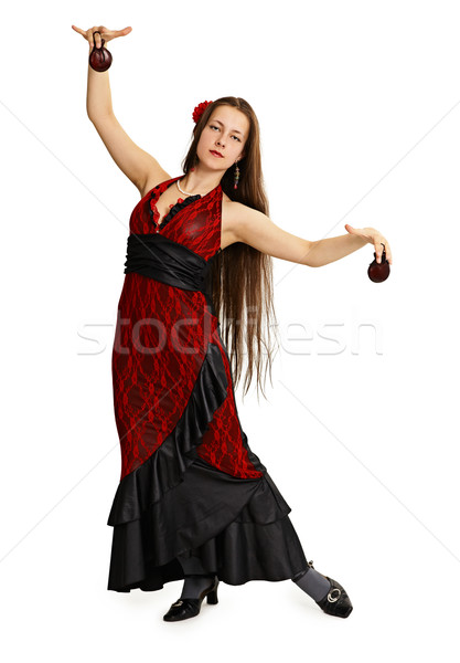 Stock photo: Young girl in red dress performs Spanish dance