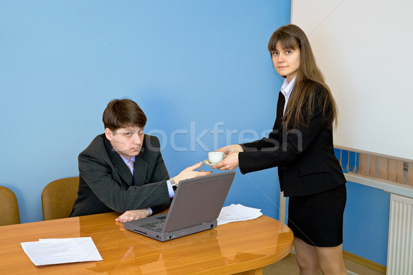 Secretary gives a cup to the chief Stock photo © pzaxe