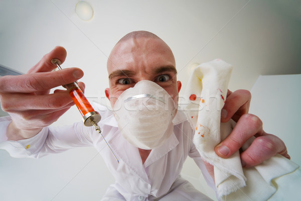 Baljós orvos injekciós tű kéz arc Stock fotó © pzaxe