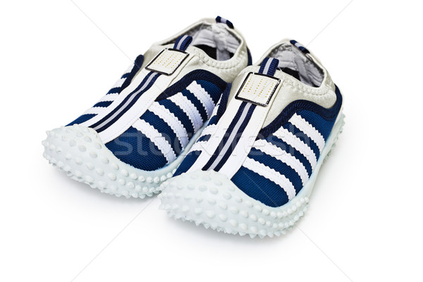 Sports inexpensive shoes on white Stock photo © pzaxe