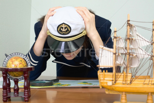 Girl - the sea captain with a card Stock photo © pzaxe