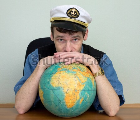 Woman in sea uniform and globe Stock photo © pzaxe