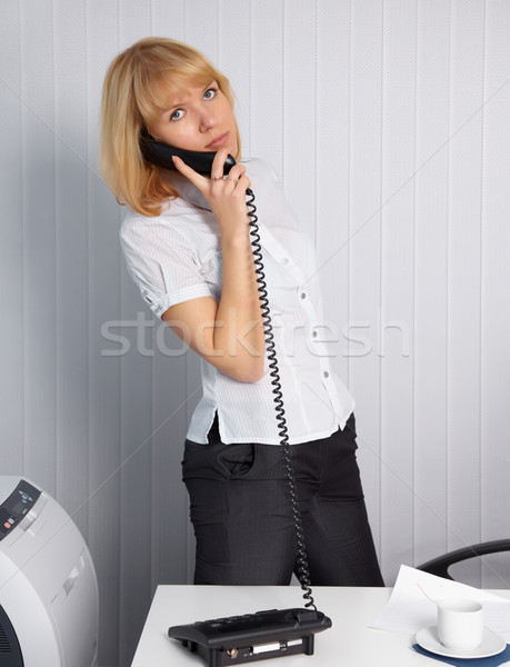 Young woman calls by phone Stock photo © pzaxe