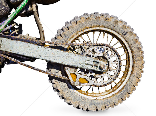 Stock photo: Rear wheel motorcycle for trial covered with mud