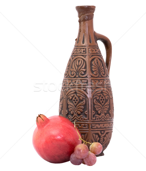 Still-life with a bottle and pomegranate Stock photo © pzaxe