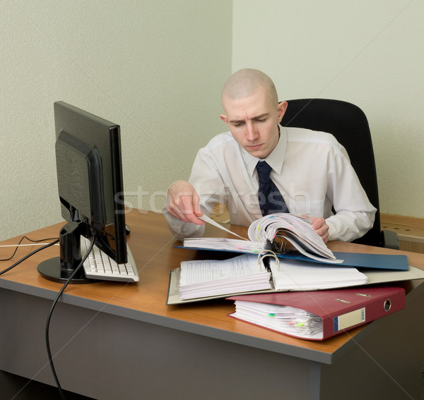 Bookkeeper on a workplace at office Stock photo © pzaxe
