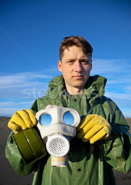 Man in a overalls with a gas mask Stock photo © pzaxe