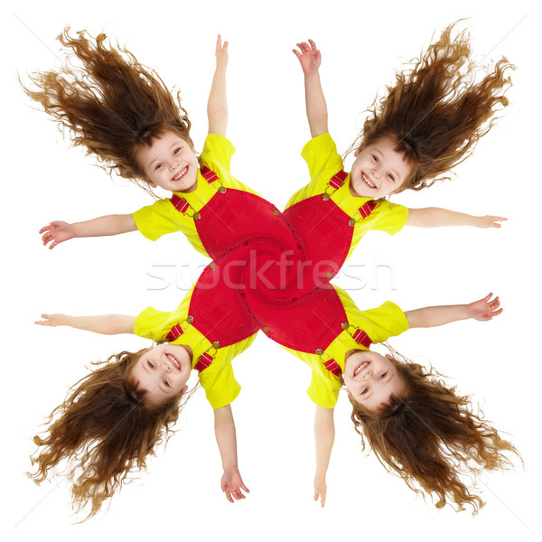 Cheerful collage - pinwheel of smiling little girls Stock photo © pzaxe
