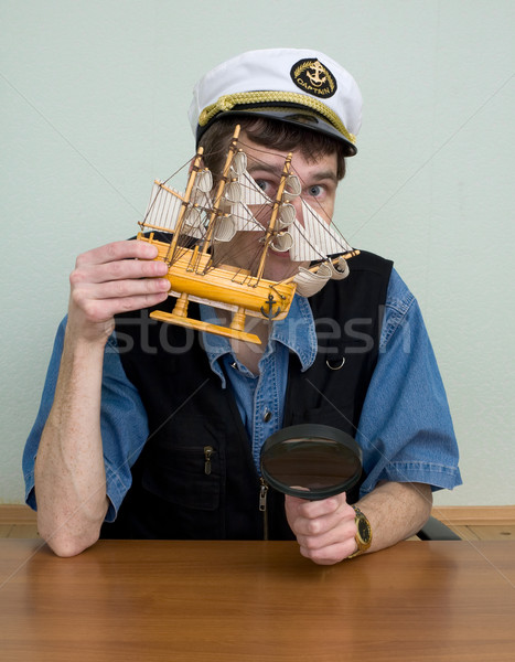 Man in uniform cap with sailer Stock photo © pzaxe