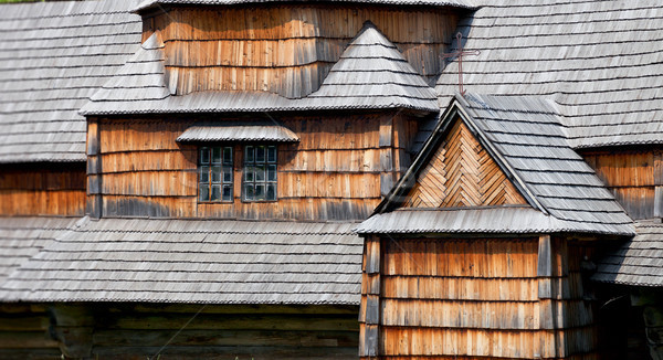 Fragments of facade of the old wooden architecture Stock photo © pzaxe