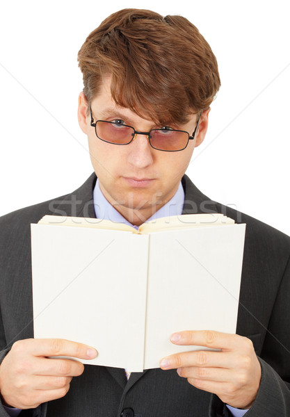 Serious man gets acquainted with contents of book Stock photo © pzaxe