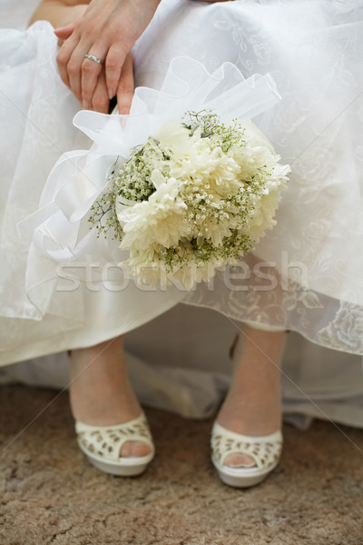 Bouquet of bride against dress and shoes Stock photo © pzaxe
