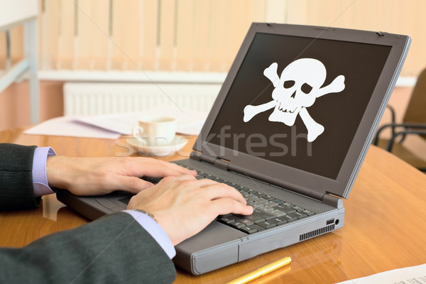Laptop with pirate software Stock photo © pzaxe