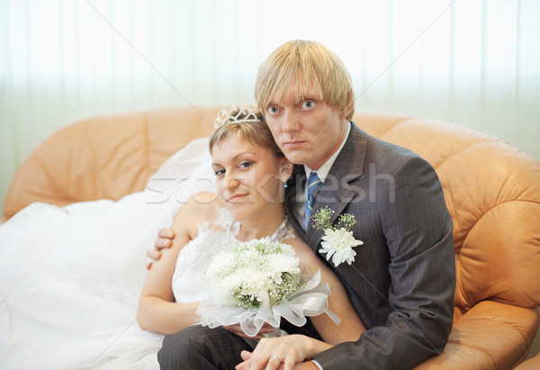 Future husband and wife on leather sofa Stock photo © pzaxe